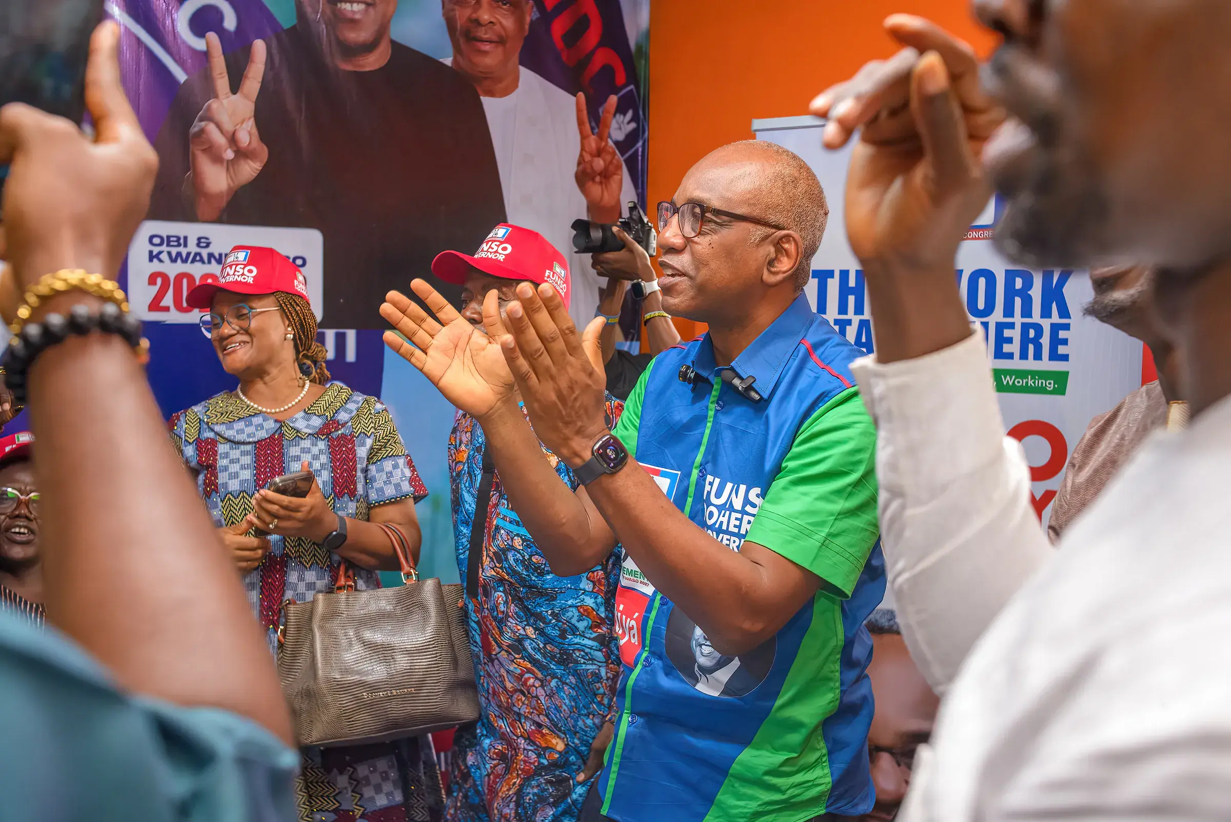 Funso Doherty with people during his visit to Alimosho.