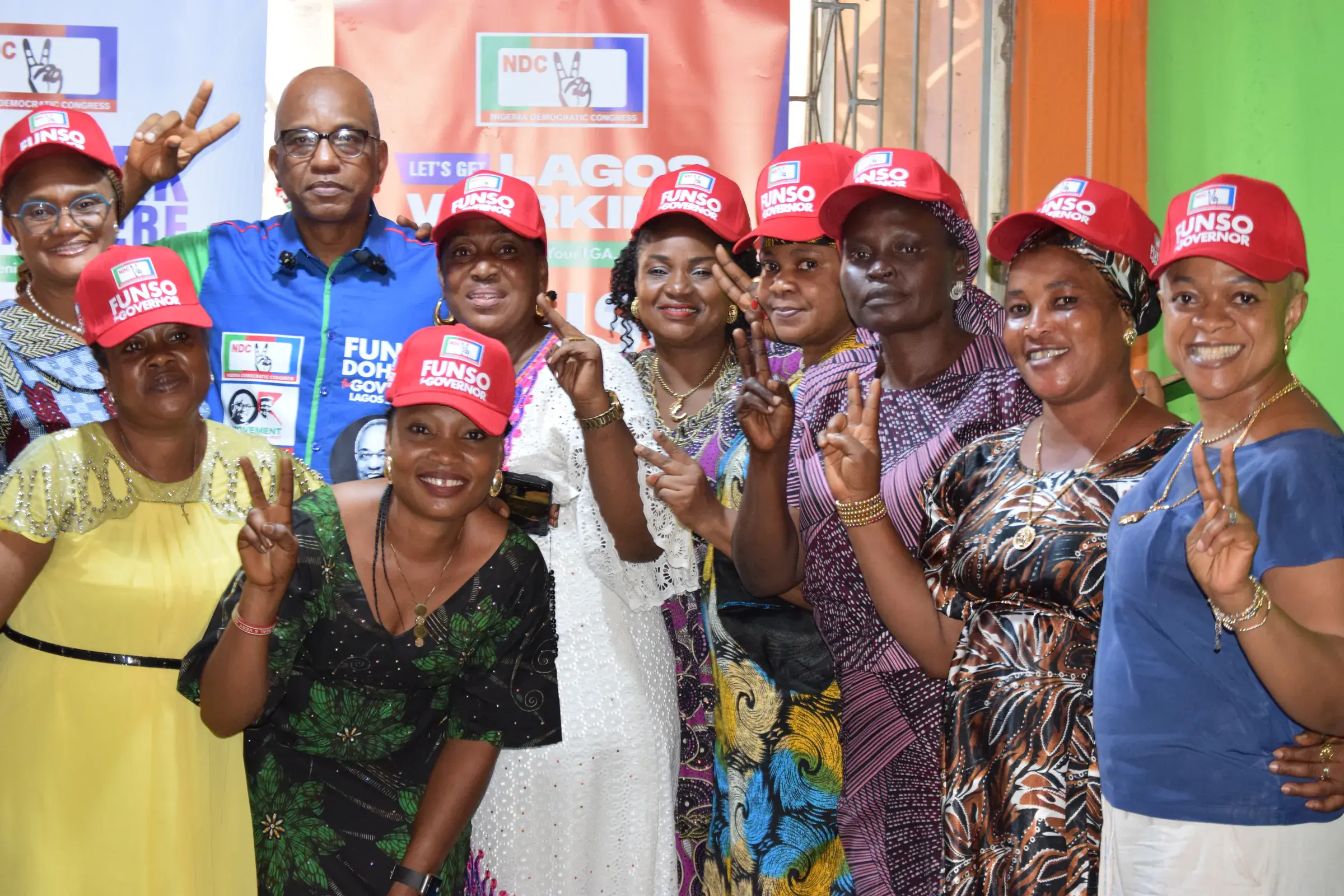 Funso Doherty with people during his visit to Alimosho.