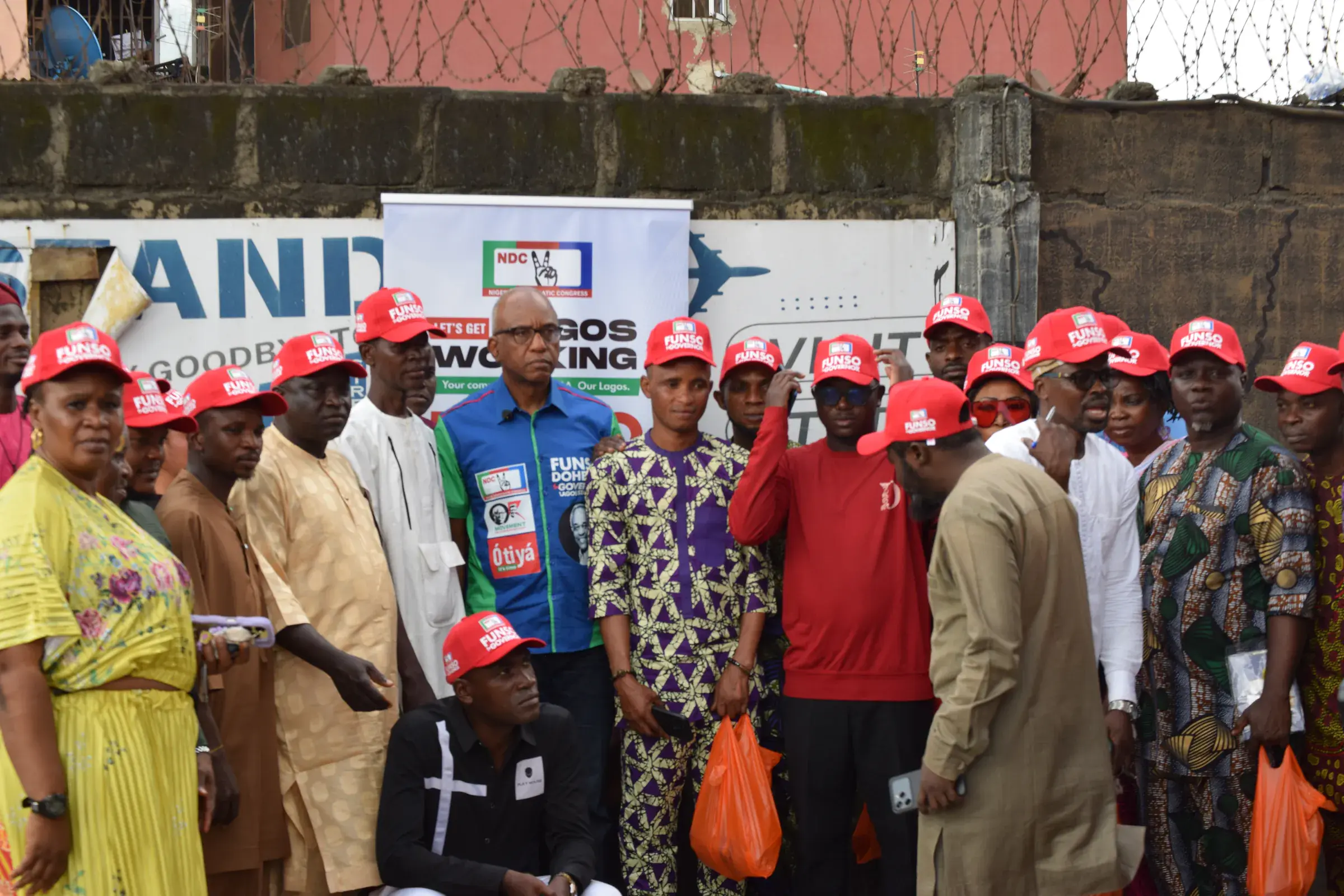 Funso Doherty with people during his visit to Alimosho.