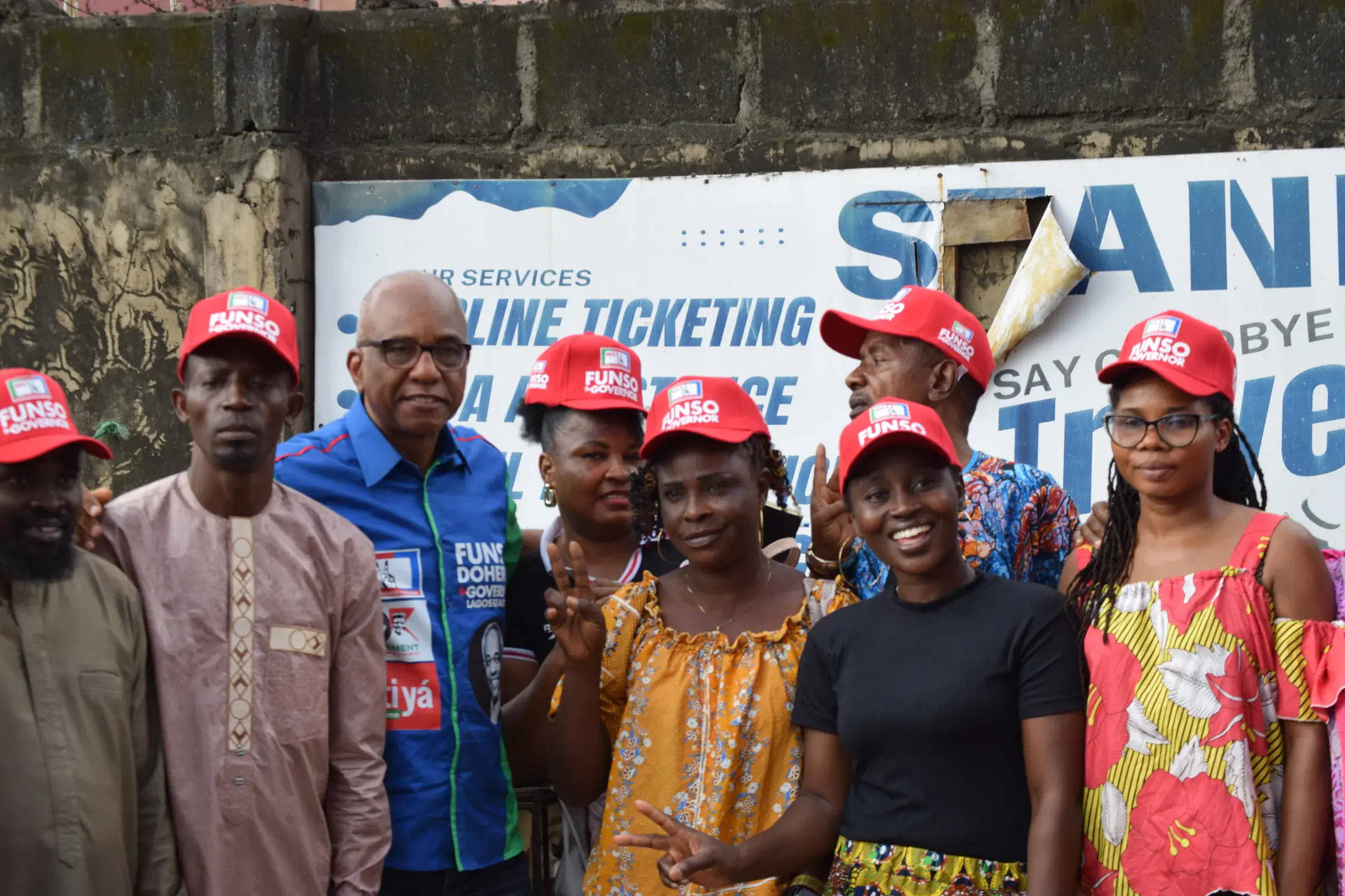 Funso Doherty with people during his visit to Alimosho.