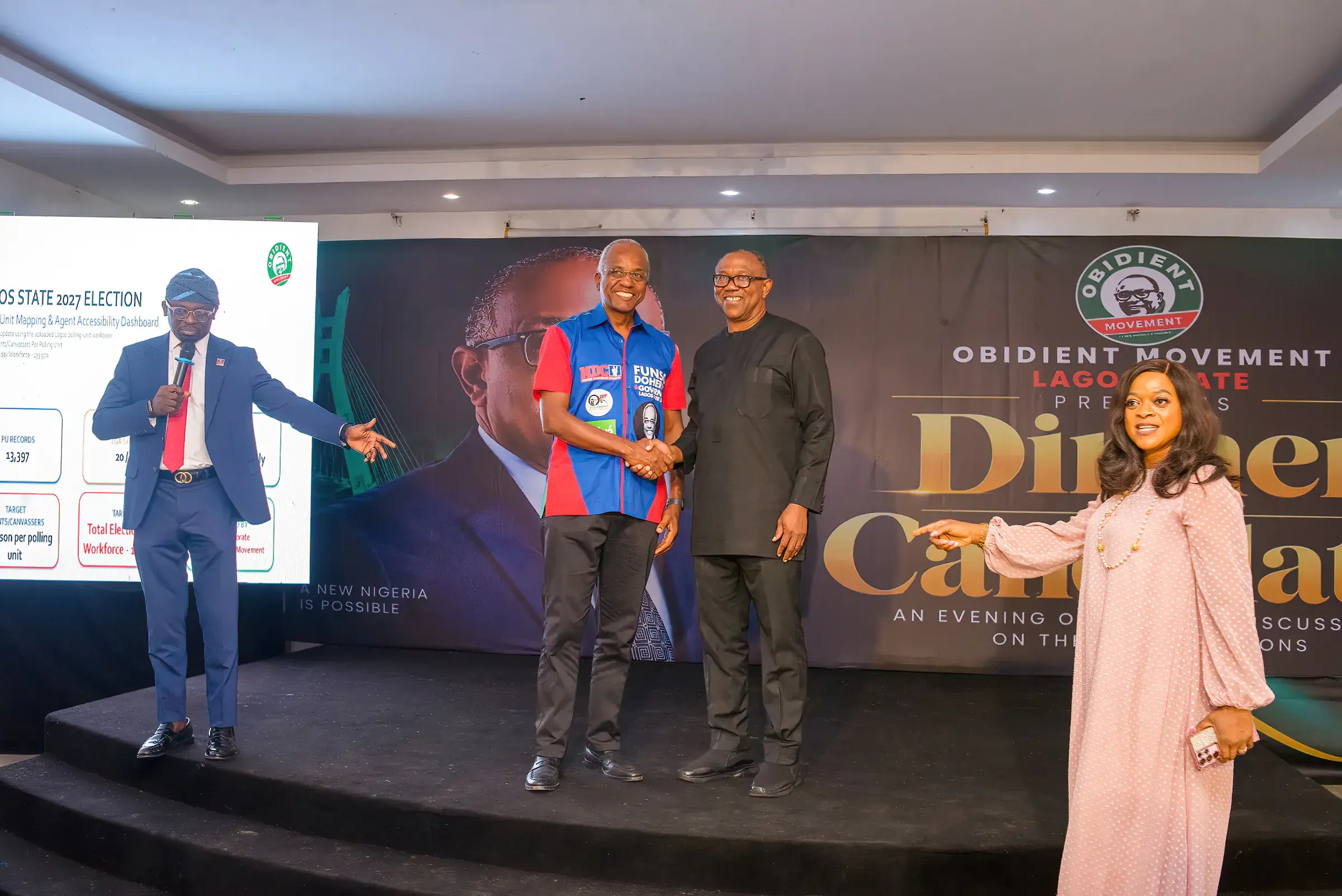 Funso Doherty and Peter Obi, the NDC presidential candidate, on stage at the Candidates' Dinner.