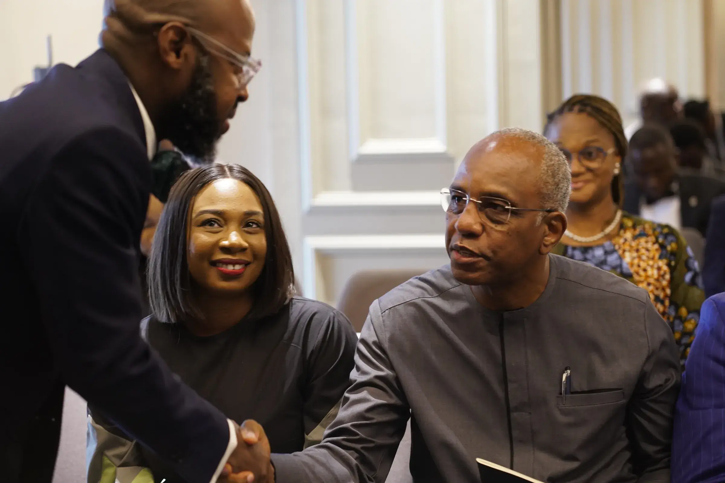 Funso Doherty with people at a law event.